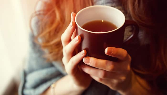 woman enjoying black tea